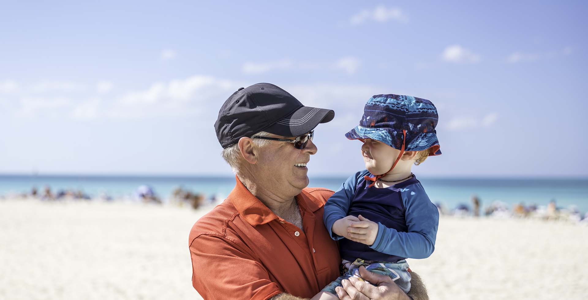 Man and toddler on beach