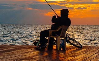 Man fishing on dock