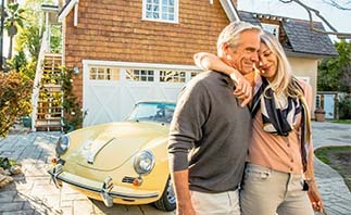 Couple in front of house